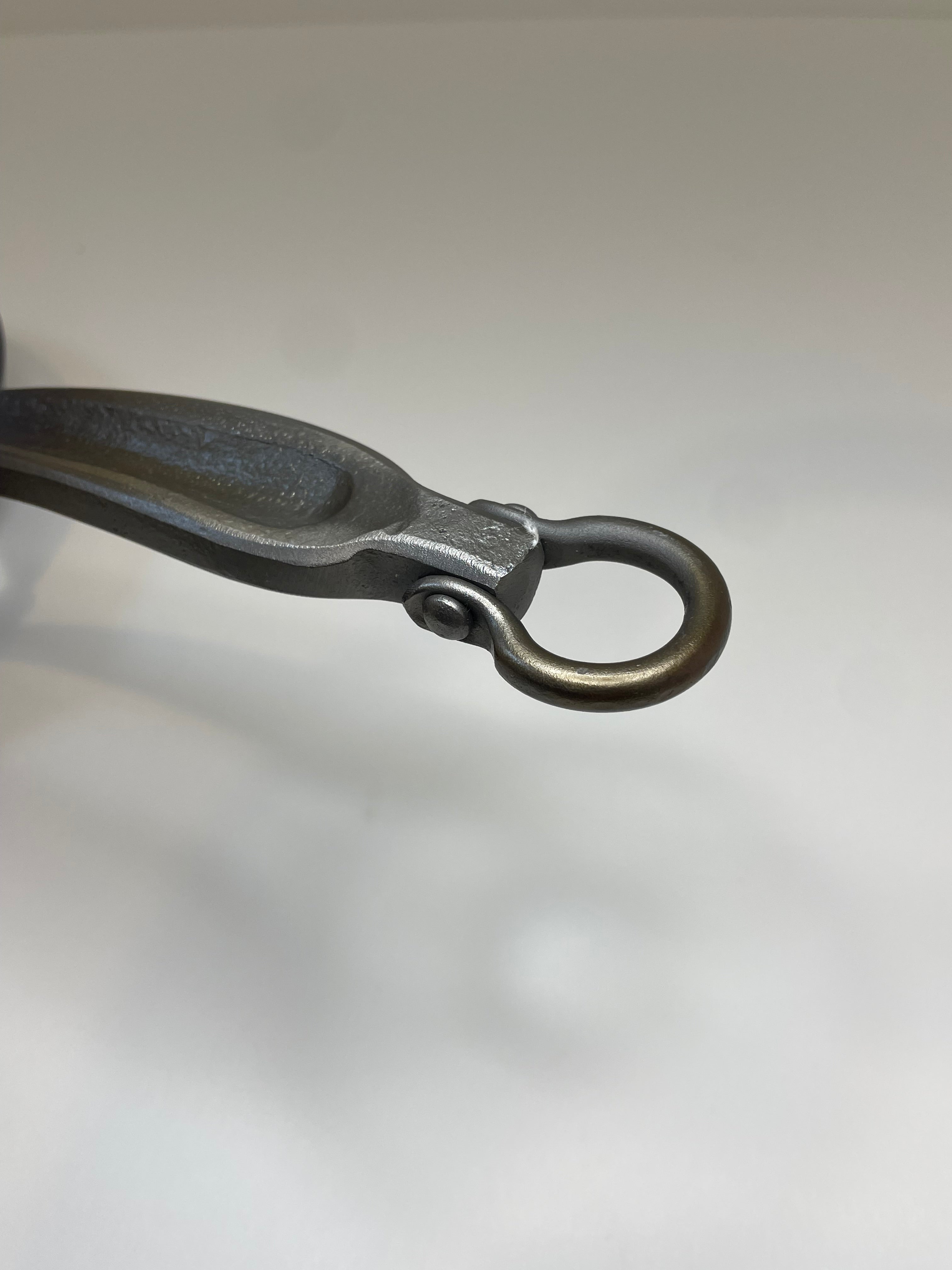 3 Nail Ironware's signature moving bail on the end of one of their pan handles.